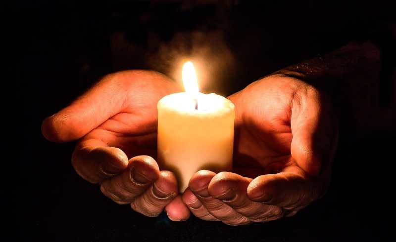 burning candle in hand burning candle in hand