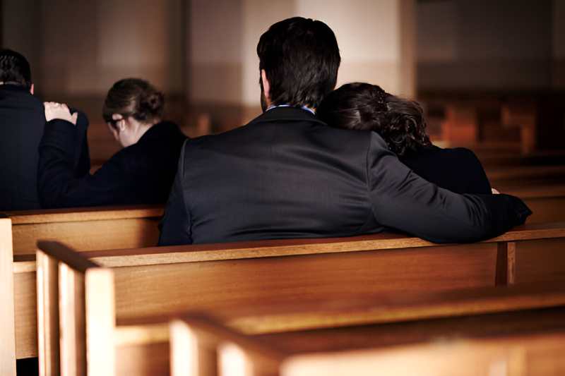 man and woman in funeral