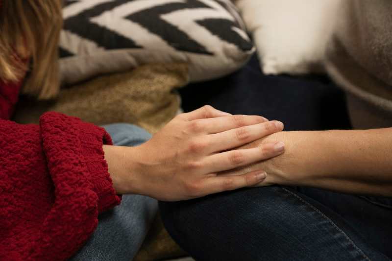 mother-daughter-holding-hands