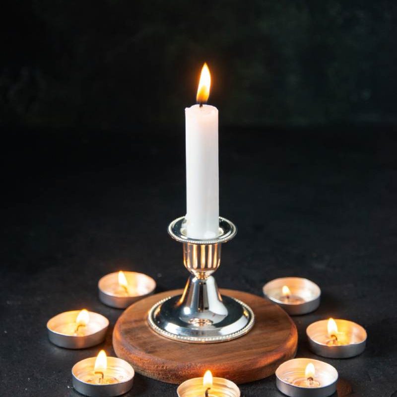 Front view of burning candles